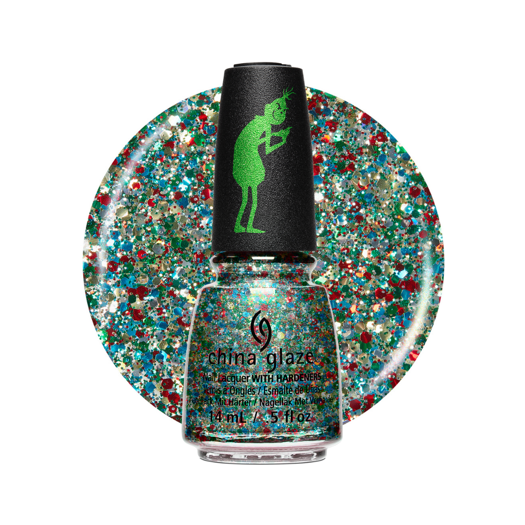 A bottle of China Glaze glitter nail polish with a black cap featuring a green silhouette logo, set against a large circular swatch of the glitter polish showing red, blue, green, and gold flecks.