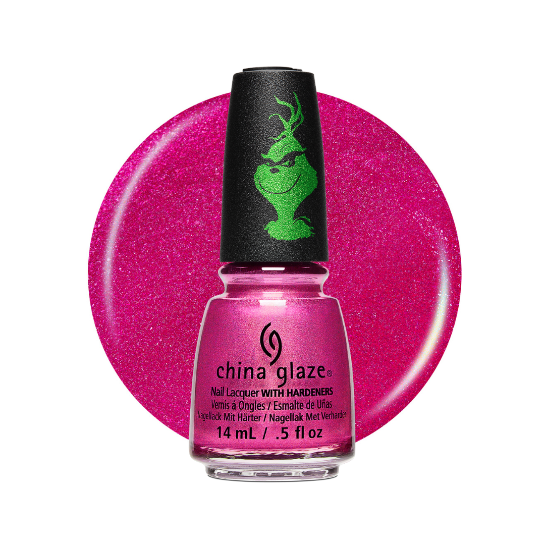A bottle of China Glaze nail polish in a bright glittery pink shade, shown in front of a matching circular color swatch on a white background. The bottle has a black cap with a green Grinch-style face graphic.