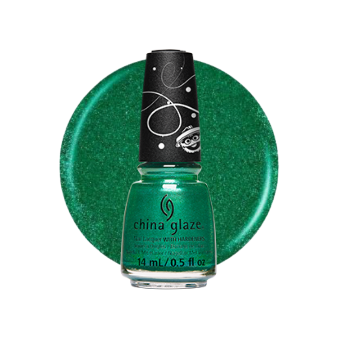 A bottle of China Glaze nail polish in a sparkling emerald green shade, set against a matching circular green glitter swatch on a white background.