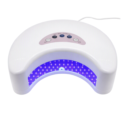 White LED nail lamp with a curved design, featuring a control panel with buttons and a glowing blue-purple LED light array inside, shown on a white background.
