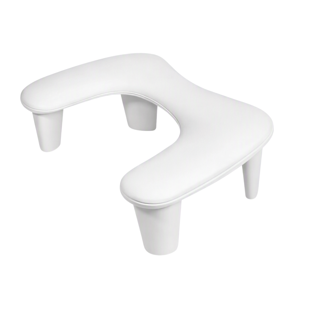 A white contoured manicure nail armrest with cylindrical legs, shown from a three-quarters perspective on a solid white background.