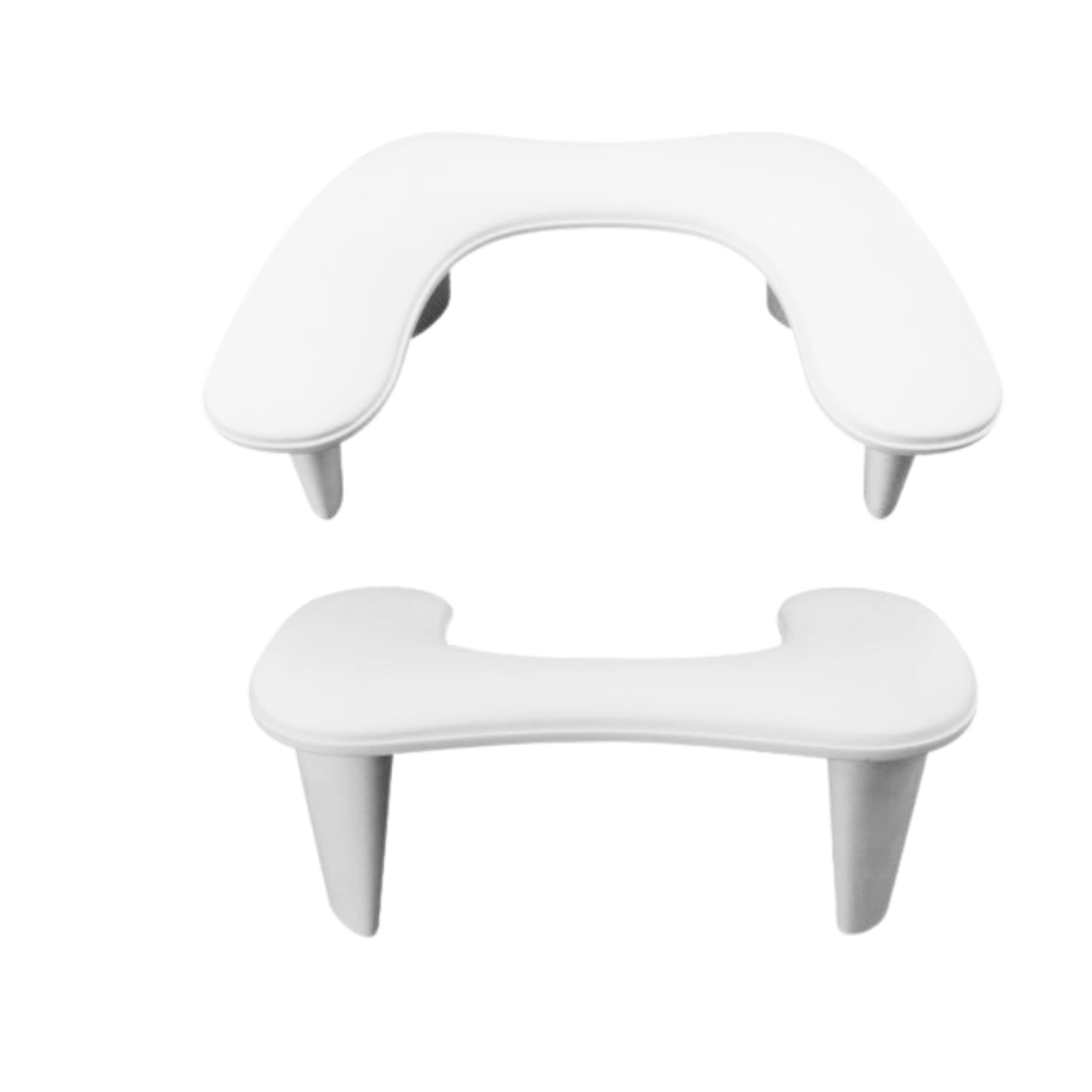 A pair of white molded plastic armrests shown on a plain white background, one above the other.