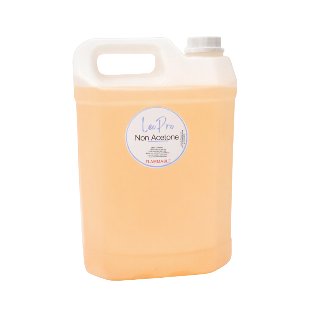 A large translucent plastic jug filled with pale peach-colored liquid, featuring a white handle, white cap, and a round white label reading 'Lee Pro Non Acetone' on a plain white background.