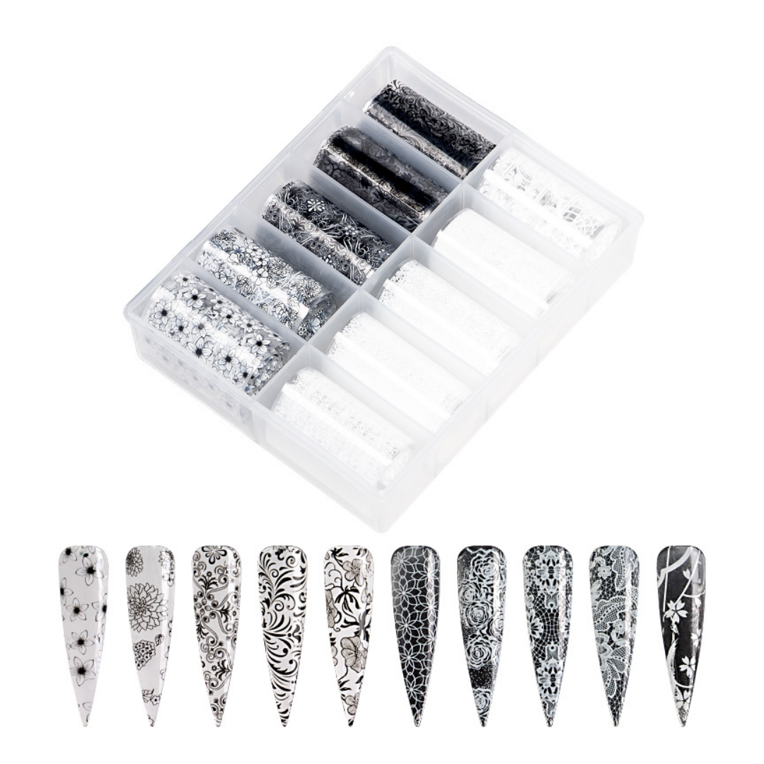 A clear plastic organizer tray holding multiple compartments of black-and-white patterned nail wraps or nail strips, shown on a white background with ten sample nail tips displayed below.