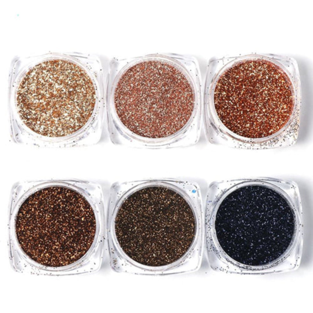 A set of six nail powder glitters in different shades, including gold, brown, red, black, and blue, presented in clear containers.