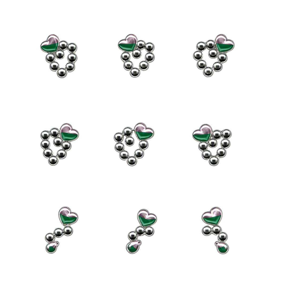 Nine small jewelry nail art charms arranged in a 3x3 grid on a plain white background. Each piece features a silver-toned metal setting with a heart-shaped top in a green and pink gradient, with a cluster of small silver oval stones below.