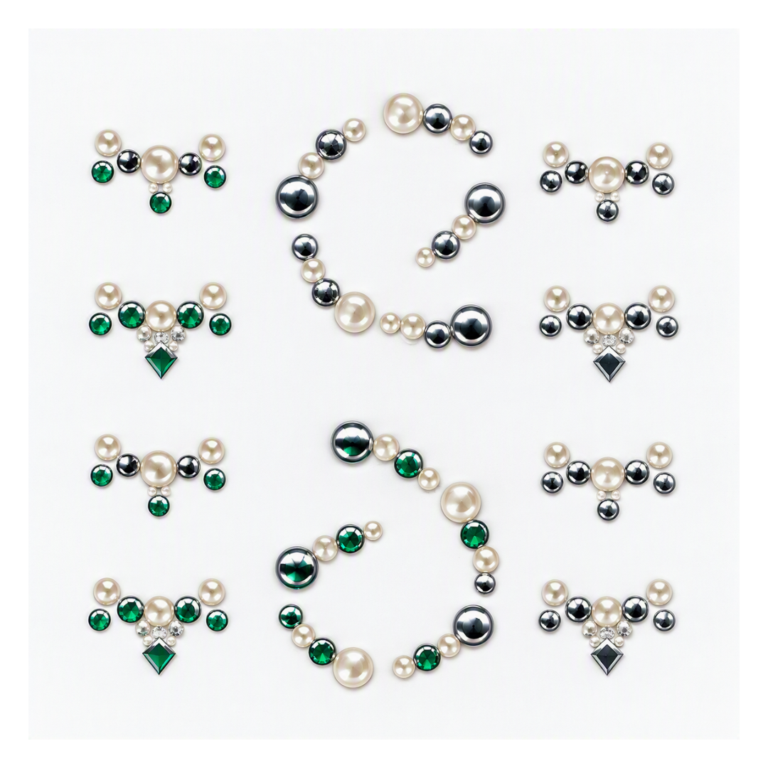 A sheet of decorative nail art stickers featuring pearl-like cream beads, metallic silver beads, and green faceted gems, arranged on a plain white background.
