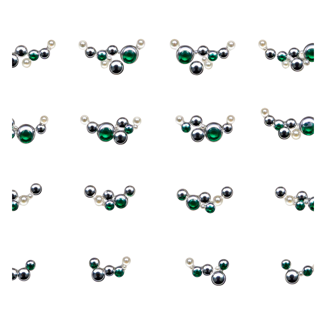 A 4x4 grid showing 16 variations of a curved barbell-style nail art jewelry piece, featuring silver-toned metal spheres, white faux pearls, and green faceted gemstone accents on a plain white background.
