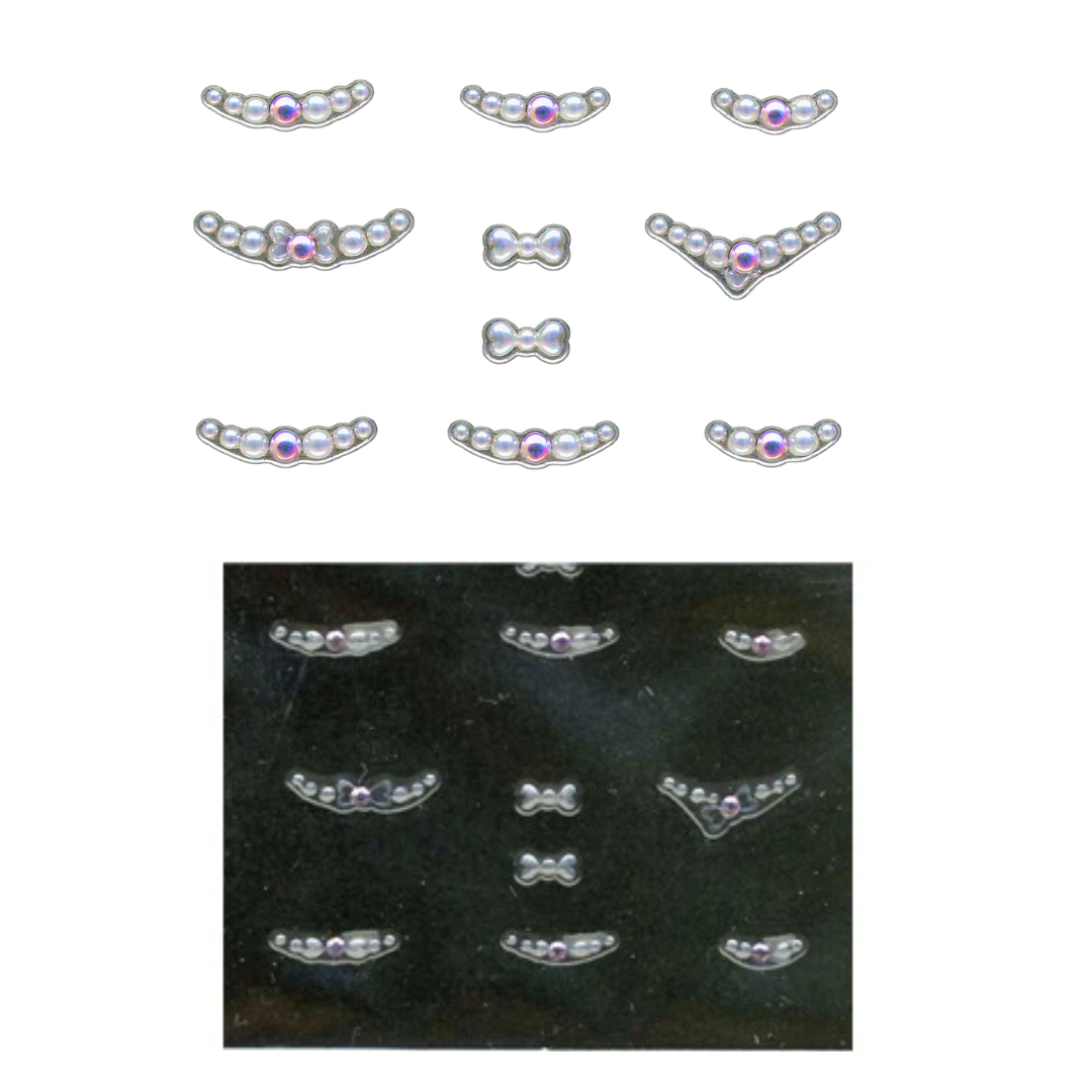 Eight silver-toned metal nail art with small white pearls and a central iridescent purple gem are shown on a white background, with a smaller inset photo below showing the clips arranged on a black surface.
