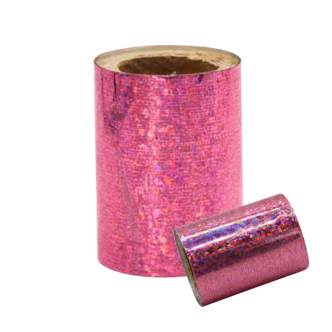 A roll of shimmering pink holographic nail art foil with a matching loose strip placed in front, shown on a plain white background.