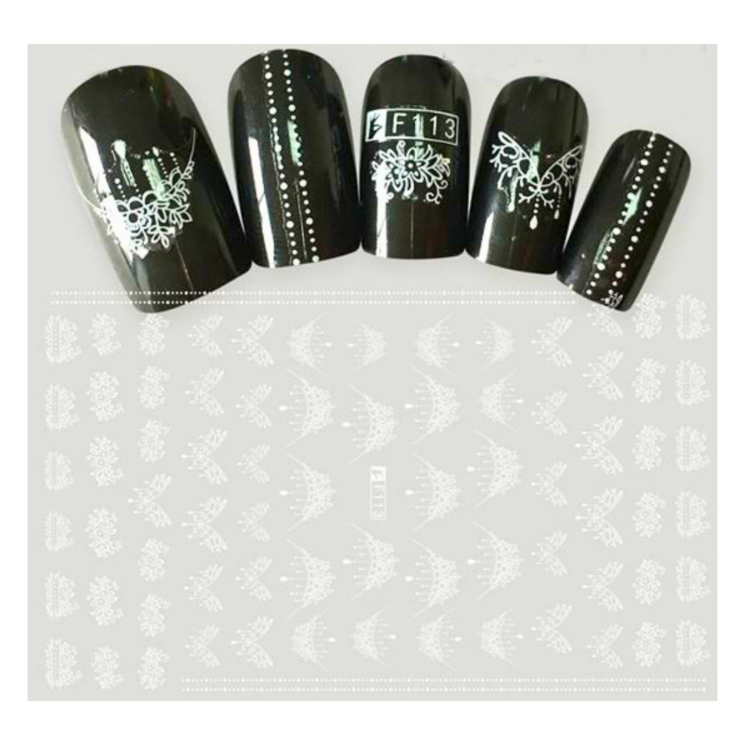 Five black manicured nails with white nail art designs are shown above a sheet of matching white nail stamping templates on a light gray background.