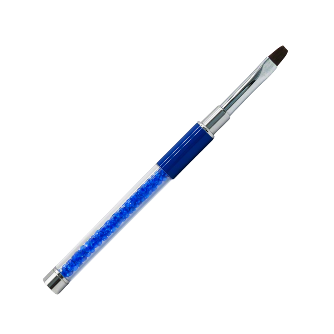 A slim gel brush with a clear handle filled with blue rhinestones, a dark blue band, and silver metal ferrule and tip.