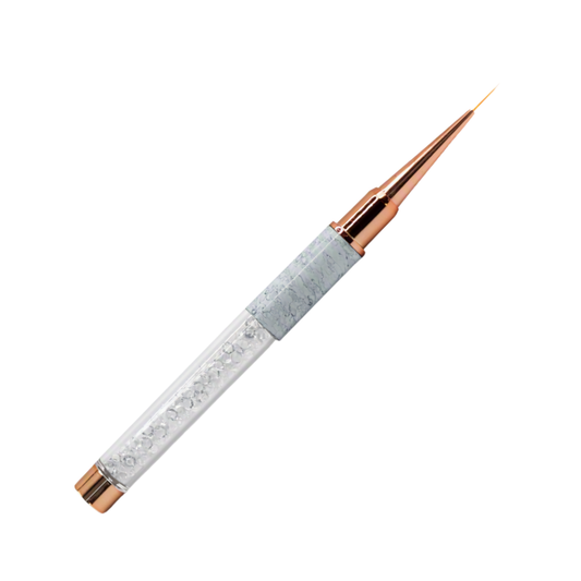 A slim pointed nail art brush with a light gray marbled handle, rose gold metal accents, and clear rhinestone detailing, shown on a plain white background.