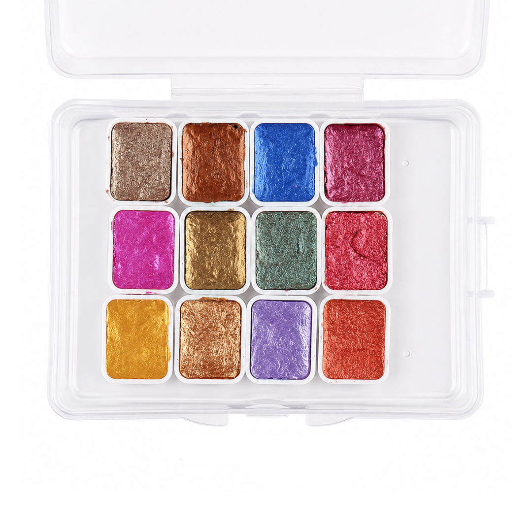 A 12-color square compact of chrome nail pigment pans in a clear plastic case, photographed from above on a white background.