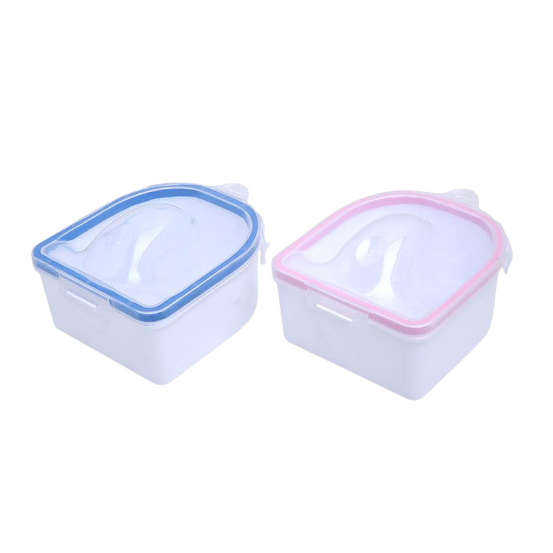 Two small square plastic nail soaking bowls with translucent lids and flip-up handles, shown on a white background. One has a blue rim and the other has a pink rim.