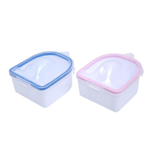 Two small square plastic nail soaking bowls with translucent lids and flip-up handles, shown on a white background. One has a blue rim and the other has a pink rim.