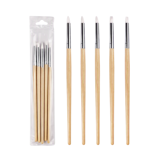 Six nail art brushes with light wood handles and white bristles, shown both inside a clear plastic hanging package and arranged upright side by side on a white background.