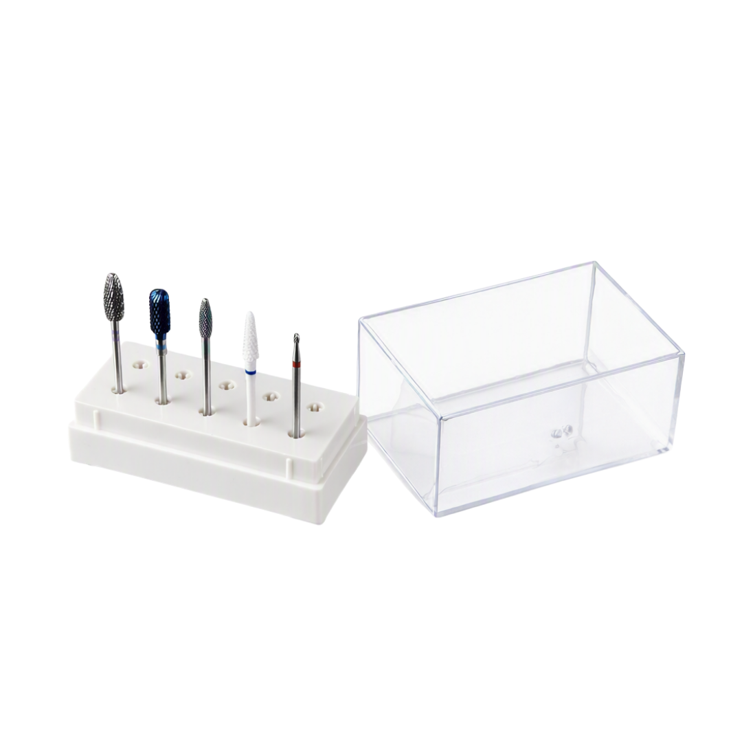A set of five beauty nail drill bits with various shapes and tips displayed on a white plastic stand, next to a clear acrylic storage box, on a white background.
