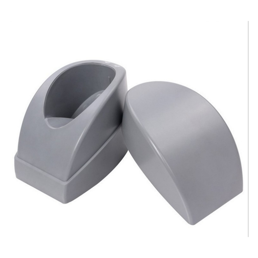 A pair of gray plastic replacement parts, likely footrests or ergonomic supports, shown on a plain white background.
