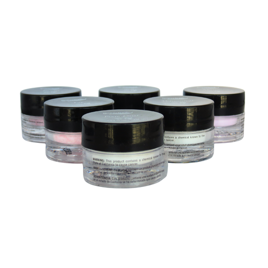 Five small cosmetic jars with black lids arranged in a cluster on a plain white background. The jars are clear plastic with clear labels and pink-toned acrylic nail powders visible in some of the jars.