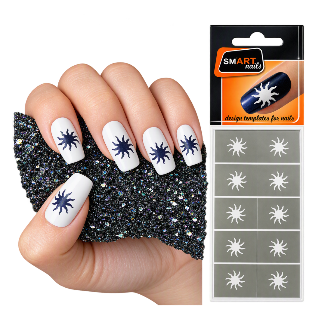 A hand with white nails decorated with dark blue starburst designs, holding a black glitter swatch card next to a retail package labeled SMART nails with matching starburst nail template stickers.