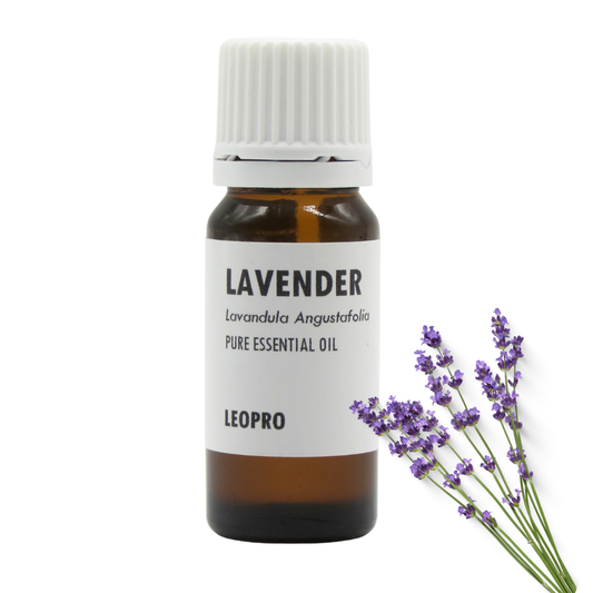 A bottle of LEOPRO Lavender Pure Essential Oil with an amber glass bottle, white cap, and white label, shown next to a sprig of fresh lavender on a white background.