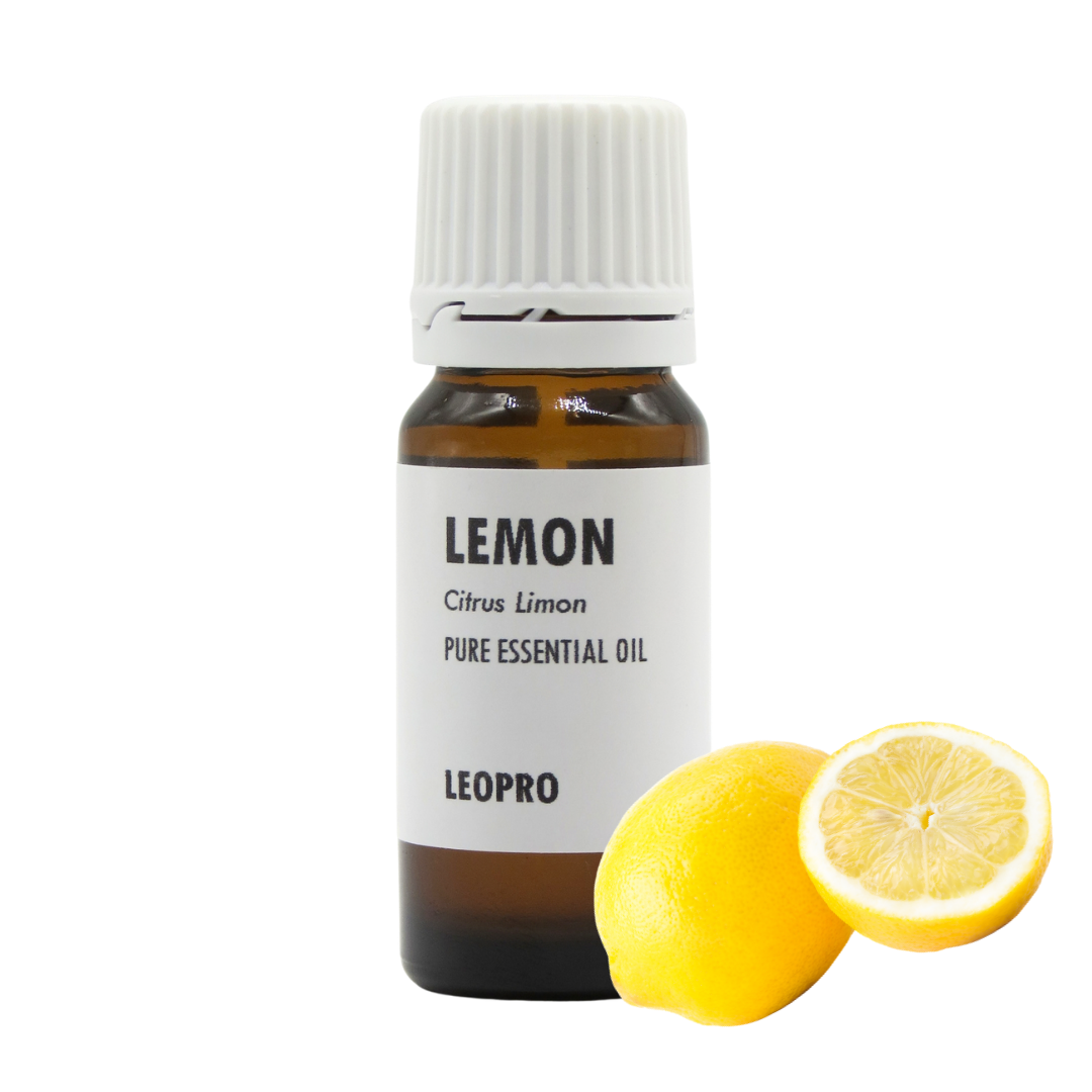 A bottle of LEOPRO Lemon Pure Essential Oil next to a whole lemon and a halved lemon on a white background.