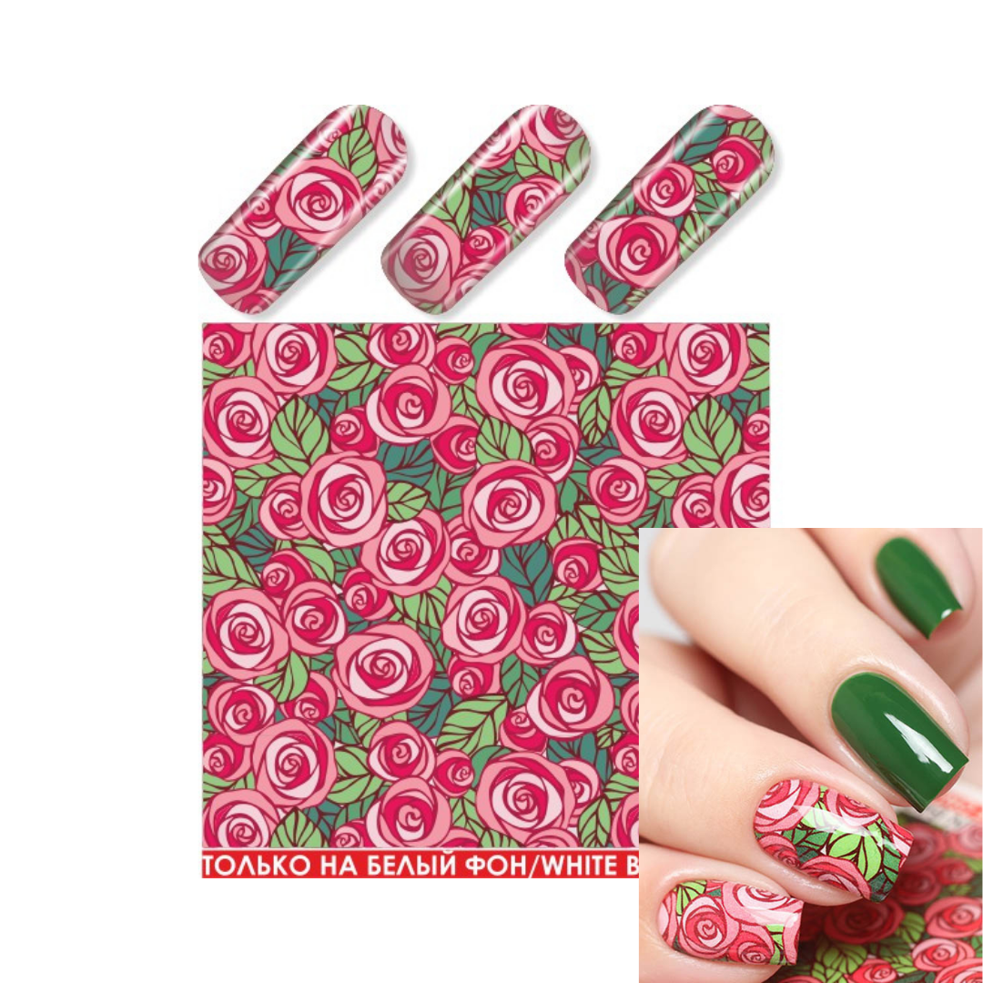 Nail art water slider sheet featuring a repeating rose design in pink and red with green leaves, shown alongside three sample nail wraps on a clear nail tip and a hand demonstrating the pattern applied to fingernails.
