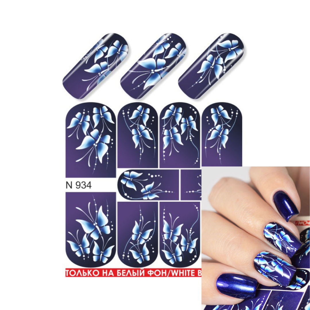 Nail art water slider sheet with blue and white floral designs on a dark purple background, shown alongside sample nail wraps and a hand displaying the finished manicure.