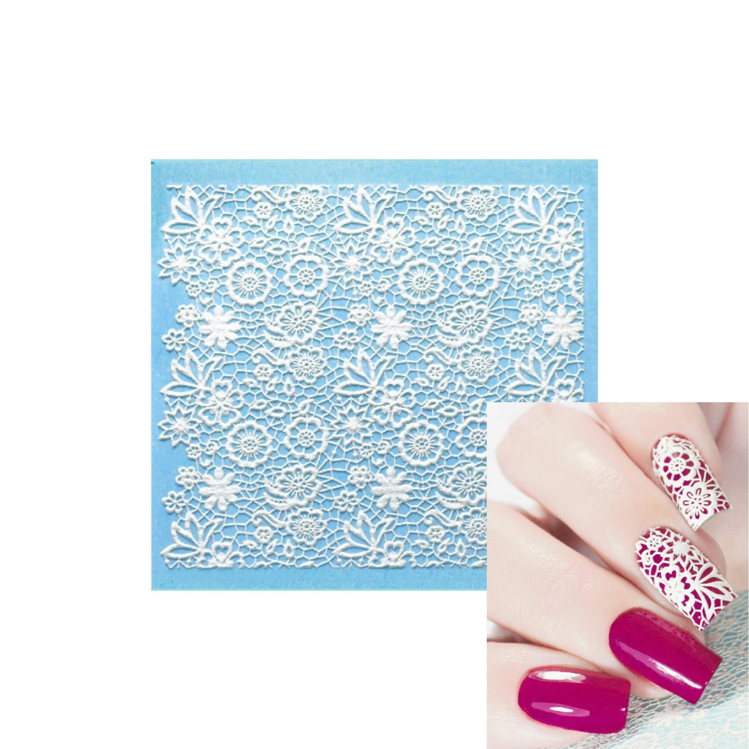 White floral lace 3d nail art sheet on a light blue backing sheet, with an inset showing a hand with magenta nail polish and white floral nail patterns.