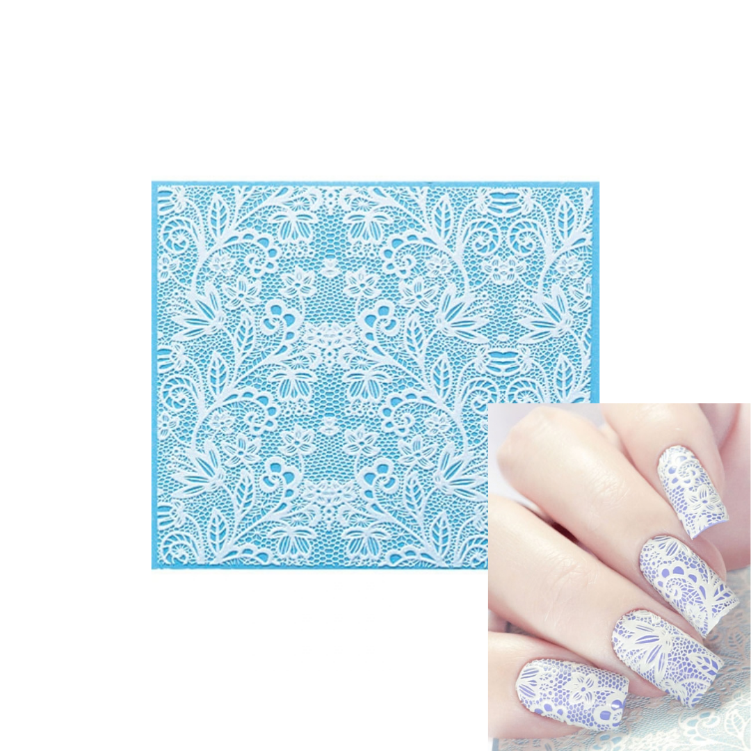 A square blue 3d nail art sheet with intricate white floral lace patterns, shown alongside a close-up of a hand with matching decorated nails on a white background.