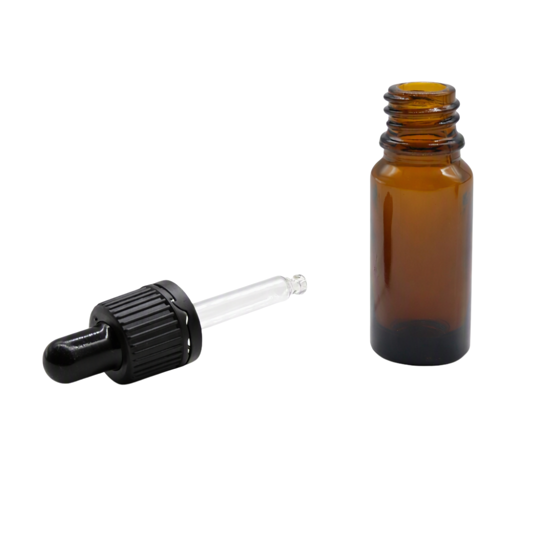 An empty 10ml amber glass dropper bottle shown next to its detached black rubber bulb and clear glass pipette on a white background.