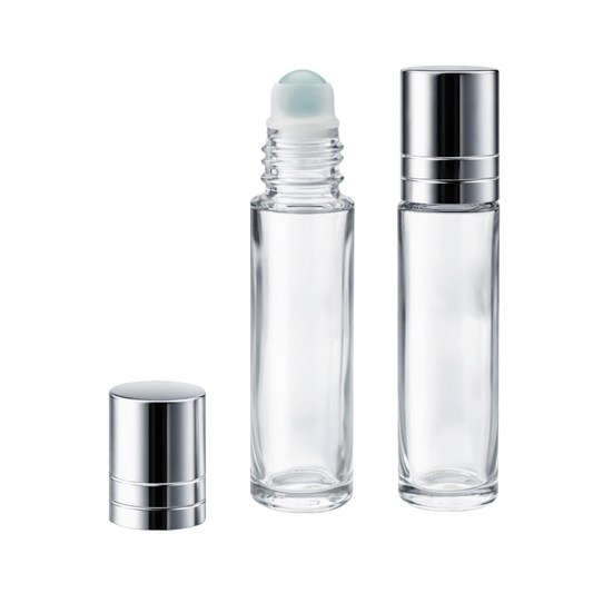 Two clear glass roller bottles with silver metal caps on a plain white background. One bottle is open with a pale blue roller ball visible, and the other two bottles are closed.