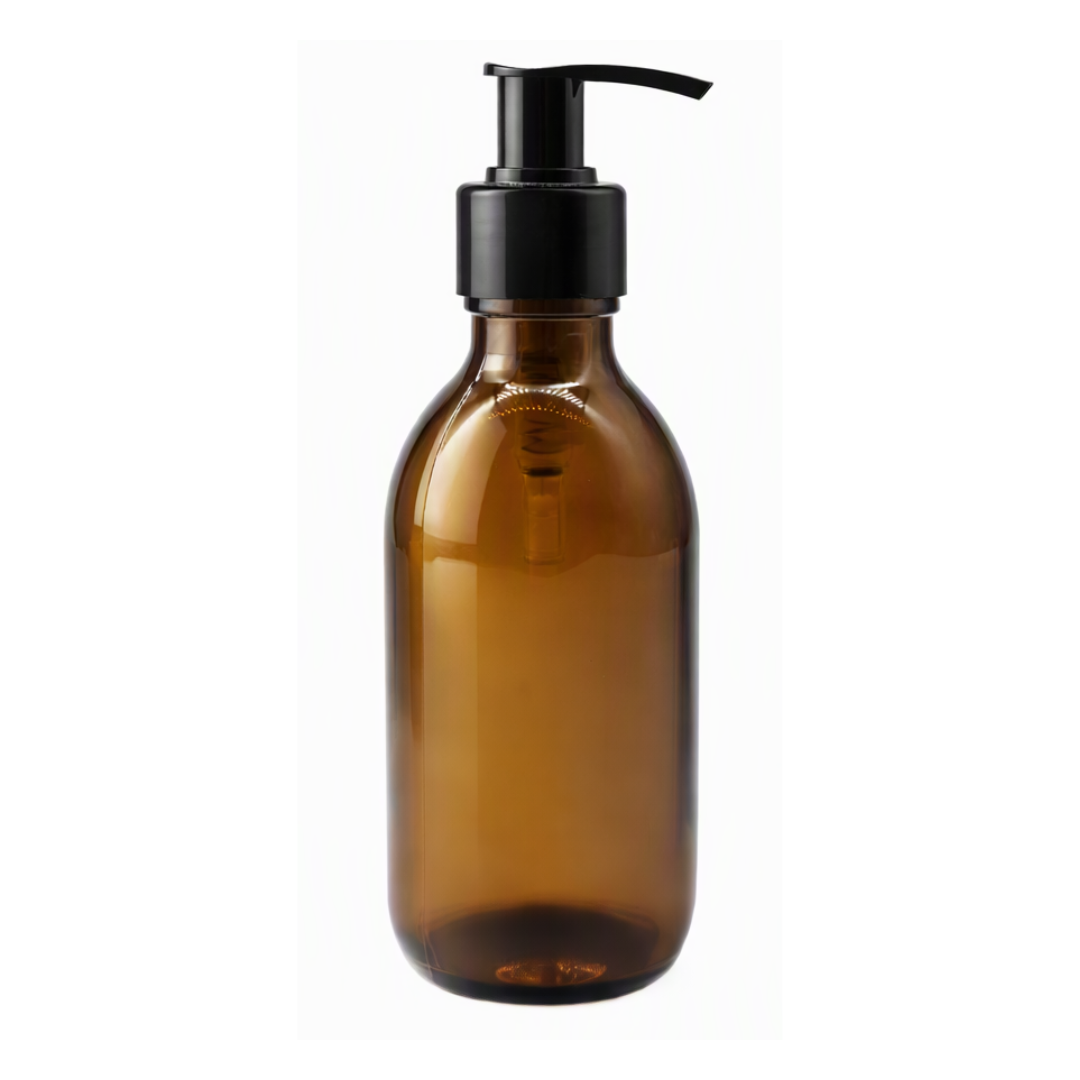 An empty amber glass bottle with a black plastic pump dispenser, shown against a plain white background.