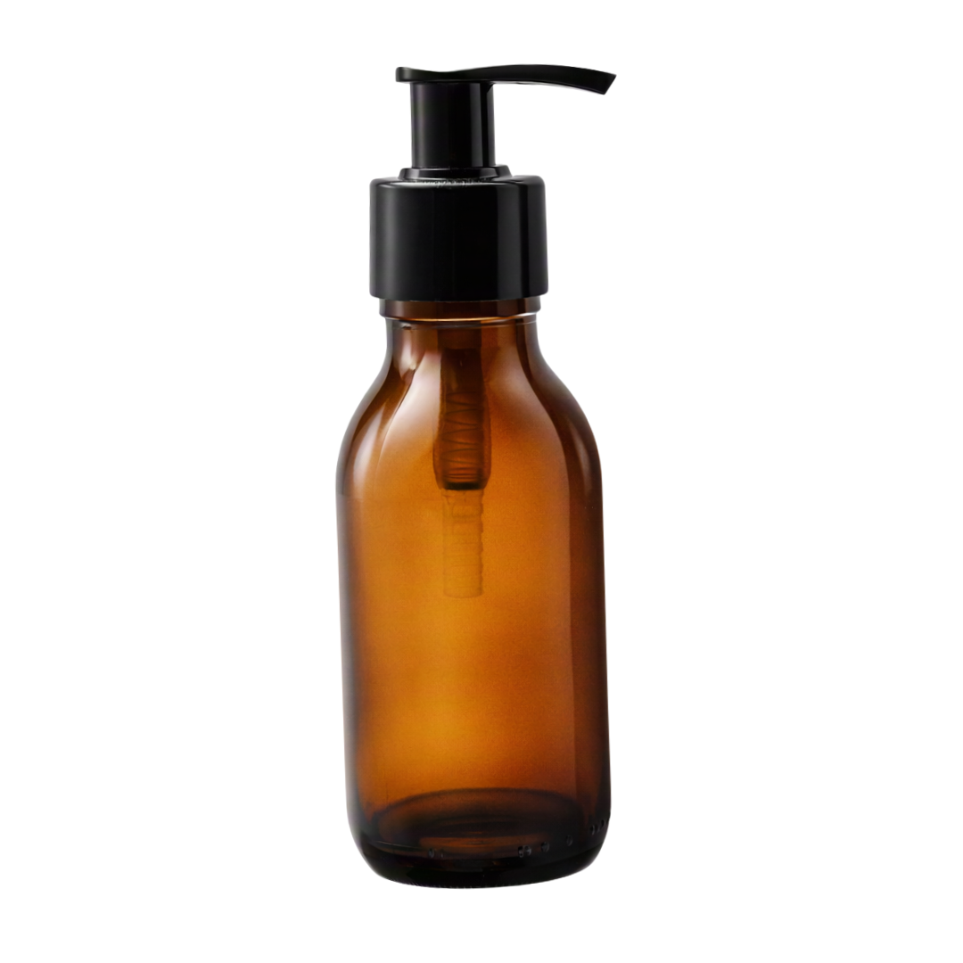 An empty amber glass bottle with a black plastic pump dispenser, shown against a plain white background.