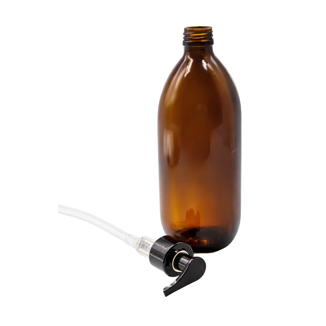 An empty amber glass bottle with a threaded neck, shown next to a clear plastic tube connected to a black pump dispenser, on a plain white background.