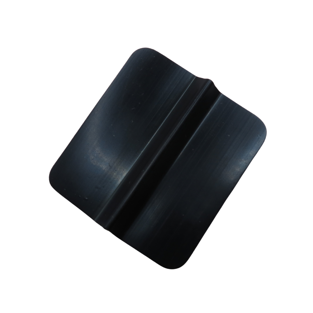 A black plastic or rubber square tens body pad with a curved, stepped profile and rounded corners, shown on a plain white background.