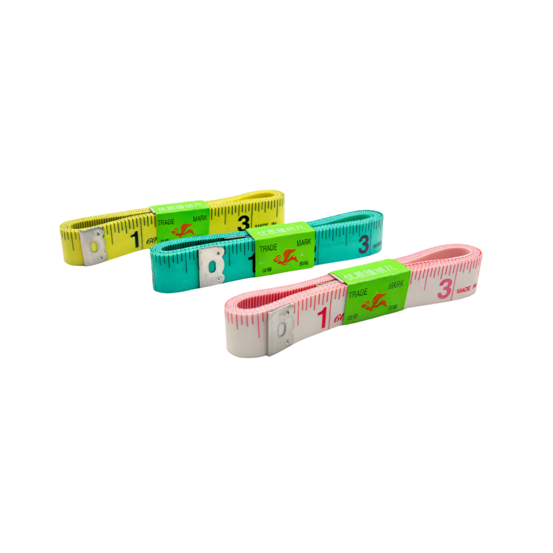 Three tape measures in yellow, teal, and pink, arranged diagonally on a plain white background.