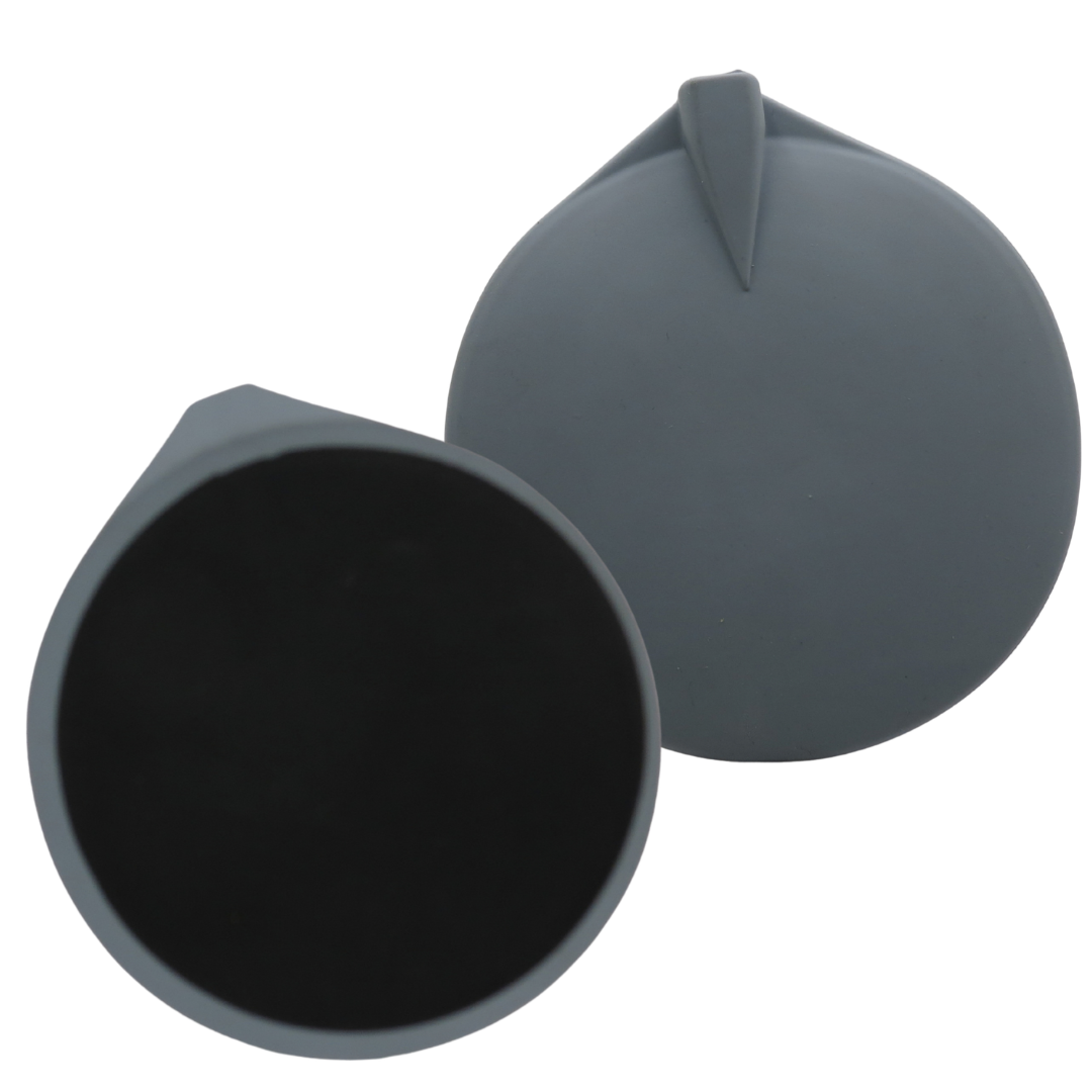 Two round silicone faradic pads with small spout- like tips shown on a plain white background. One pad revealing a dark black, and the other showing its smooth dark gray top side.