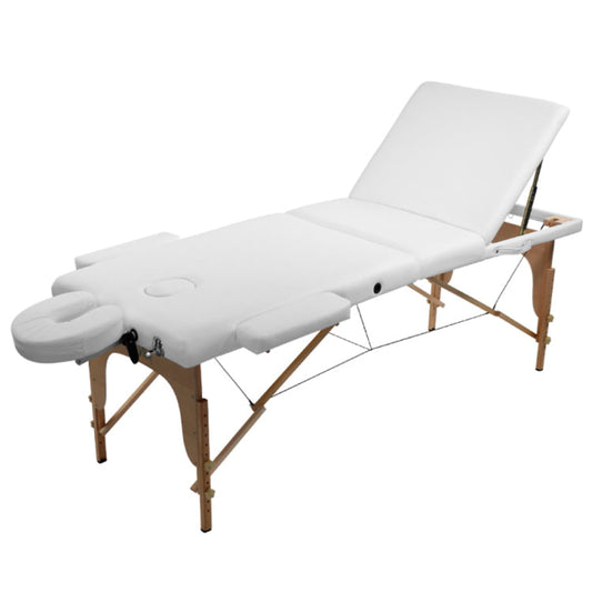 A portable white PVC massage table with a wooden frame, adjustable headrest, armrests, and a breathing hole in the bed as well as a u-shaped attachment.