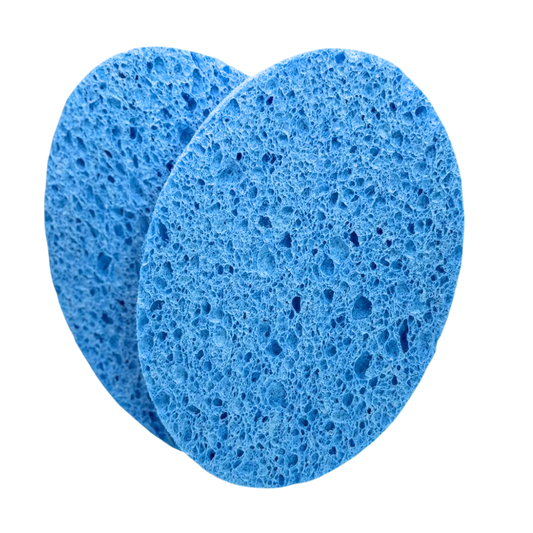 F001C Body Wash Sponges Pair for removal of body scrub and mud wraps | Two round blue body sponges with a porous sponge texture, overlapping on a solid white background.