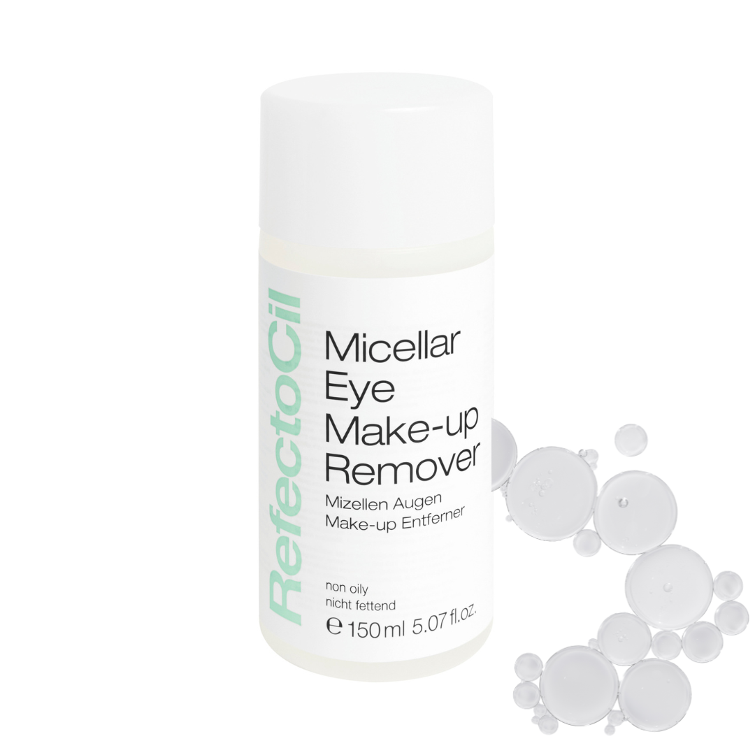 A white bottle of RefectoCil Micellar Eye Make-up Remover with black text and a vertical mint green brand name, shown on a white background with floating translucent micellar bubbles to the right.