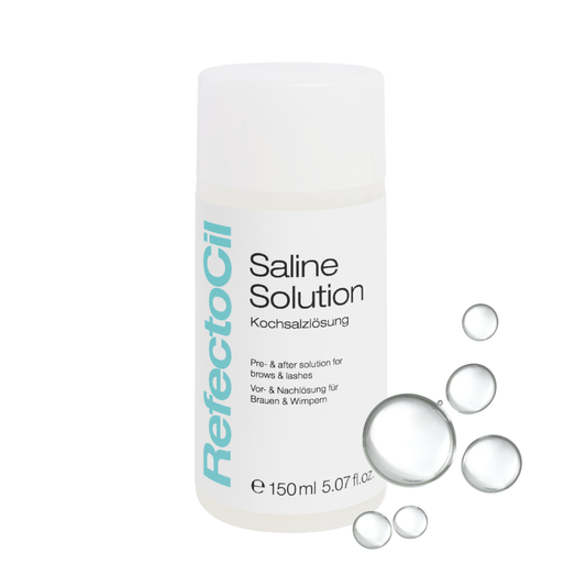 A white bottle of RefectoCil Saline Solution skincare product on a white background, decorated with floating clear liquid bubbles.