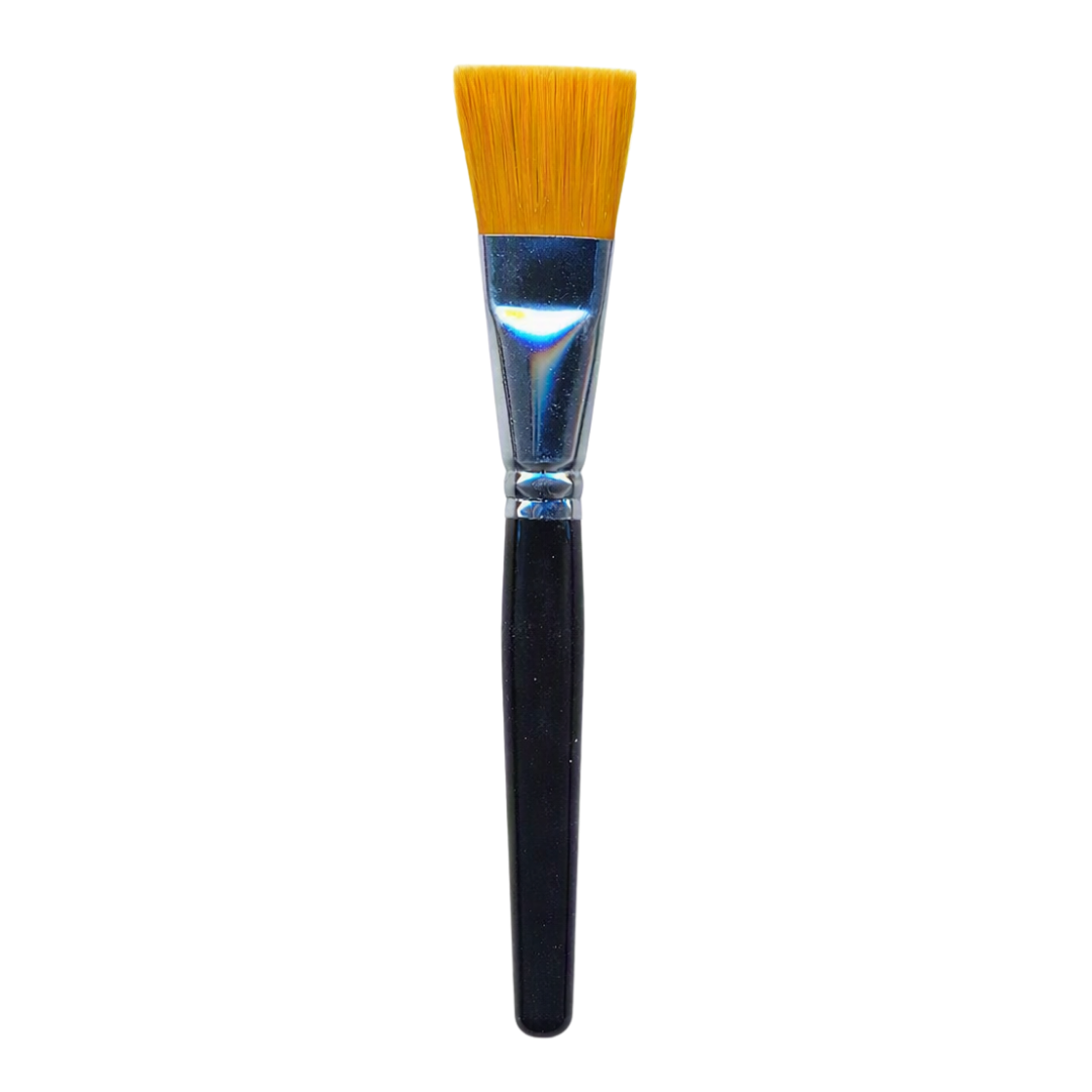 A flat facial mask brush with a black handle, silver ferrule, and golden-yellow bristles, shown vertically against a plain white background.