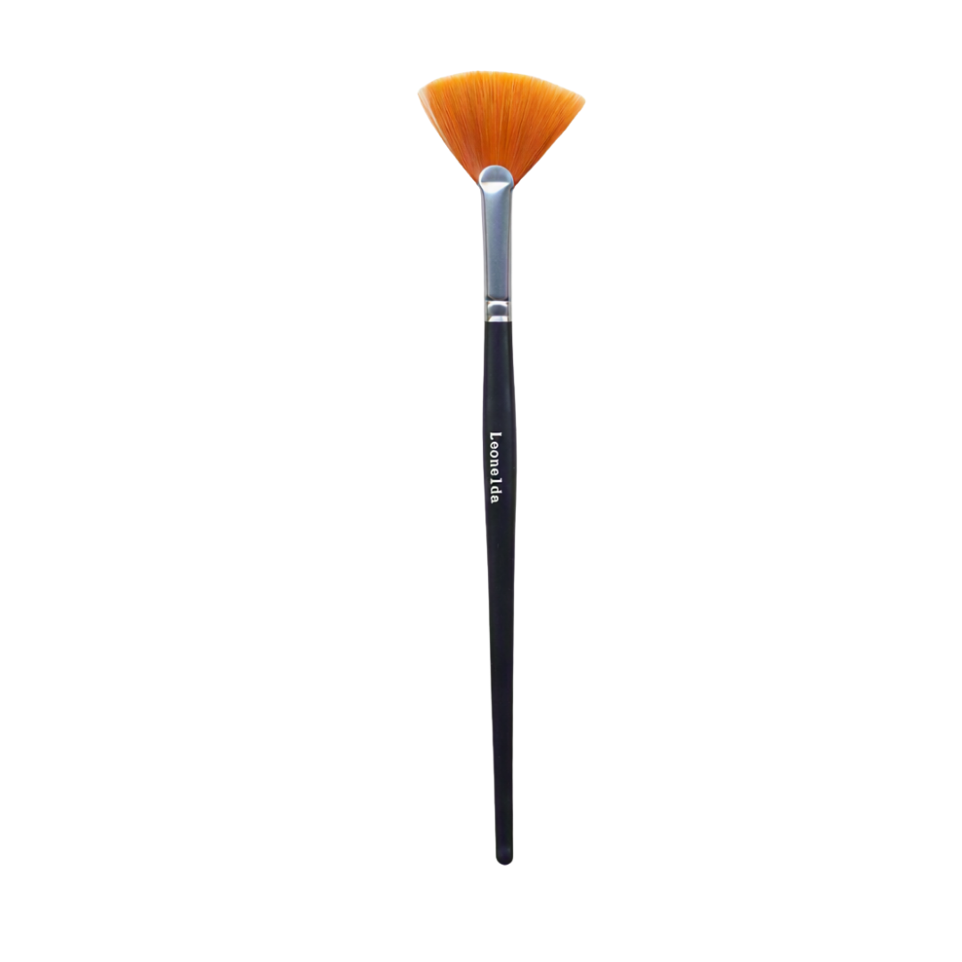 A single facial mask brush with a black handle, silver ferrule, and orange-brown bristles, shown vertically on a plain white background. The handle is printed with the brand name 'Leonelda'