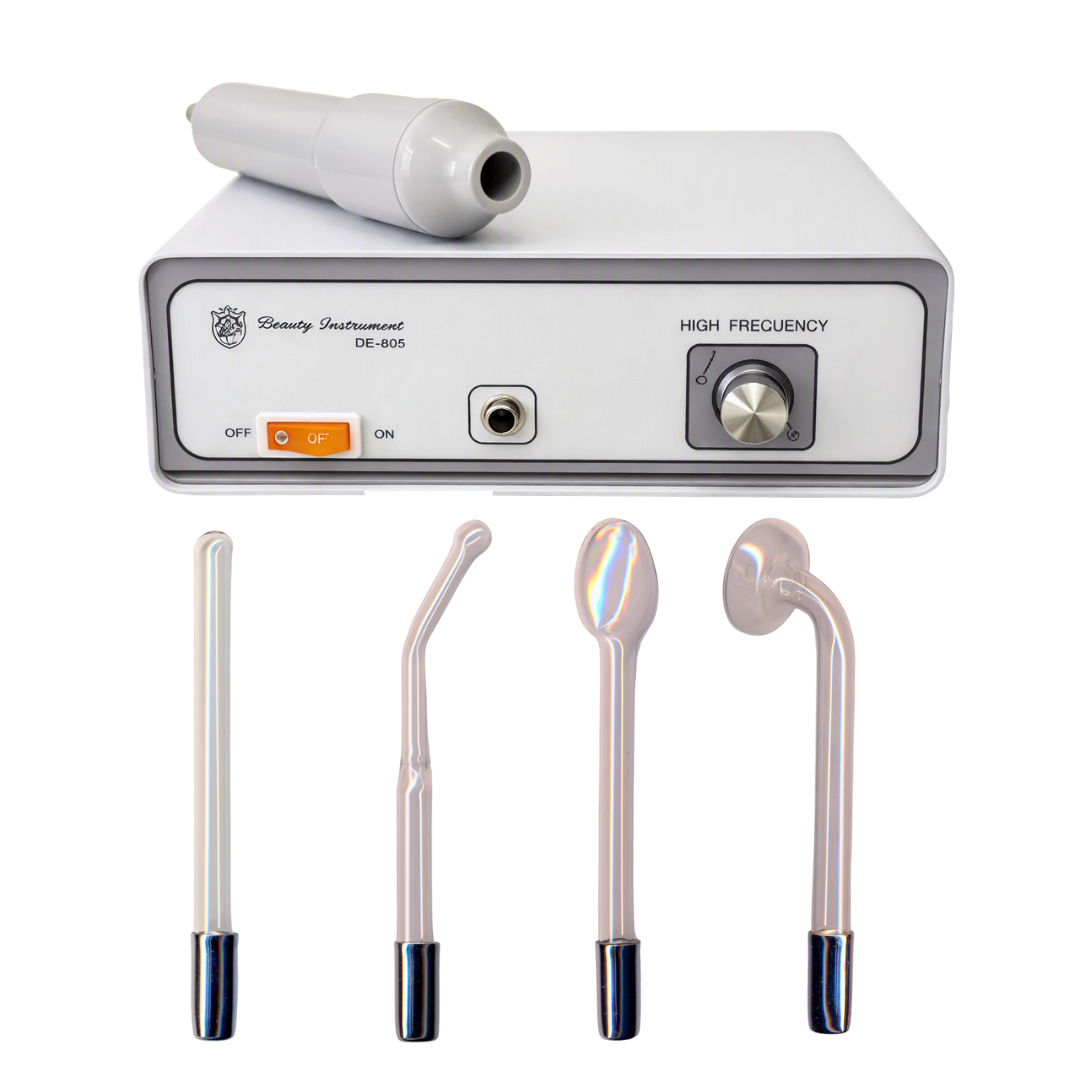 A high-frequency beauty instrument kit with a white control unit labeled DE-605, a white handheld wand resting on top, and four interchangeable metal treatment heads below on a plain white background.