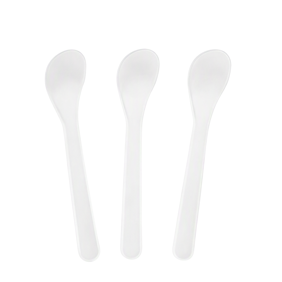 Three white plastic spoon spatulas arranged vertically side-by-side on a plain white background.