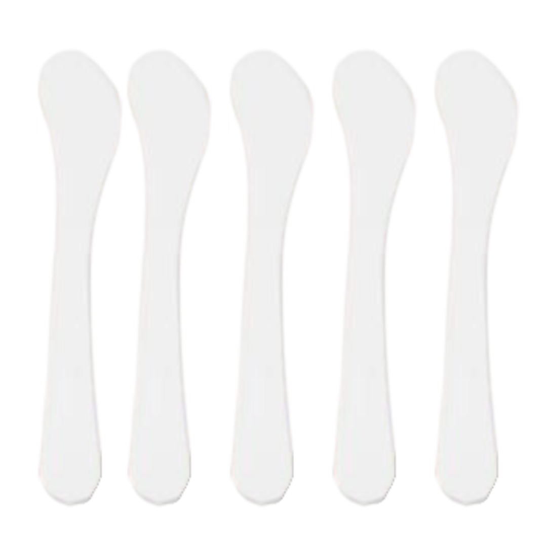 A set of five white curved spatulas arranged in a row.