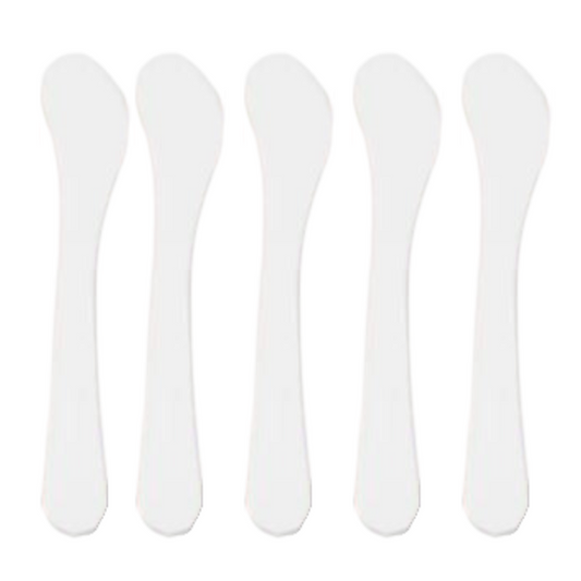 A set of five white curved spatulas arranged in a row.