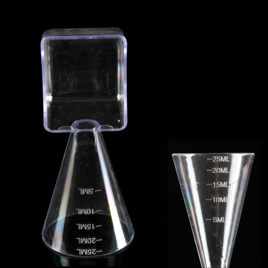 Clear plastic volumetric funnel and measuring spoon in one with a square-shaped top and printed milliliter markings, shown on a black background with a close-up inset of the funnel body.